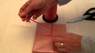 How To Tie A Ribbon On A Gift Part 1 [upl. by Brenna]