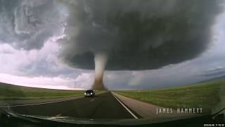 Storm chasing dashcam Tornado crossing the highway Laramie Wyoming [upl. by Nehgem]