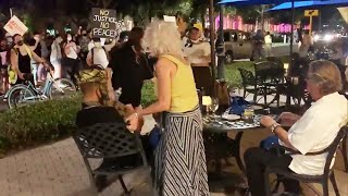 Couple Dining Outside Is Confronted by Protesters [upl. by Nerb]